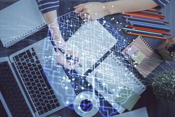 Multi exposure of writing hand on background with brain hologram. Concept of self learning.