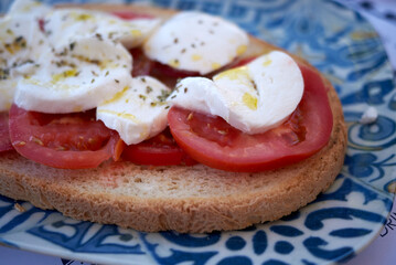 Bruschetta with mozzarella cheese and tomato