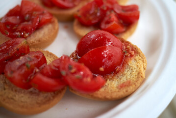 Dried bread, called friselle, with ripe tomatoes, oregano and olive oil
