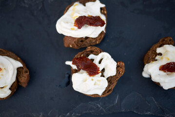 Whole grain frisella with burrata cheese and dried tomatoes