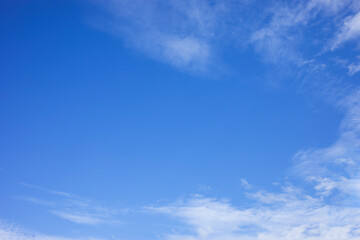 Blue sky background and white clouds soft focus, and copy space
