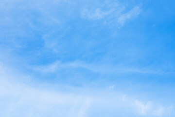 Blue sky background and white clouds soft focus, and copy space