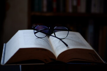 These glasses and thick books can be used as a background for computer screens, posters, banners, or calendars on the themes of literacy, spirituality, and science.
