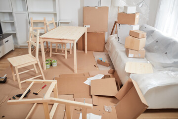 Assembling furniture in new apartment, moving in and being hardworking.