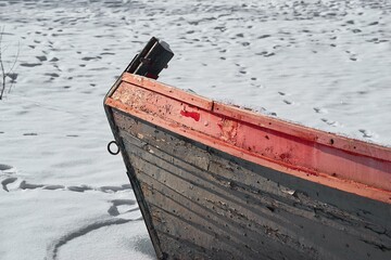 part of an old boat in the snow
