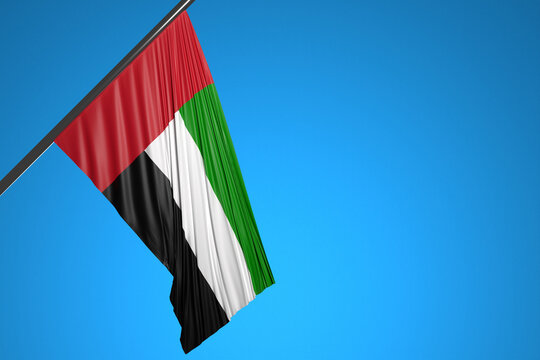 3D illustration of the national flag of United Arab Emirates on a metal flagpole fluttering against the blue sky.Country symbol.