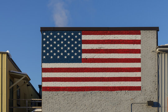 BARRE, VERMONT, USA - FEBRUARY, 20, 2020: Flag of the United States of America painted onto a wall