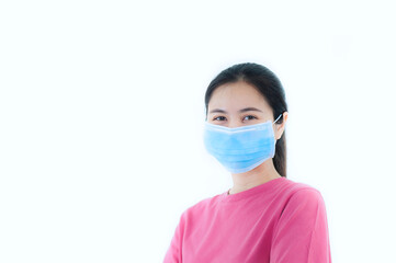 Close-up portrait of A beautiful teenage asian woman wearing a pink T-shirt and a blue medical face mask. isolated on white background.