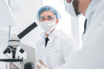 group of scientists discussing the results of testing.