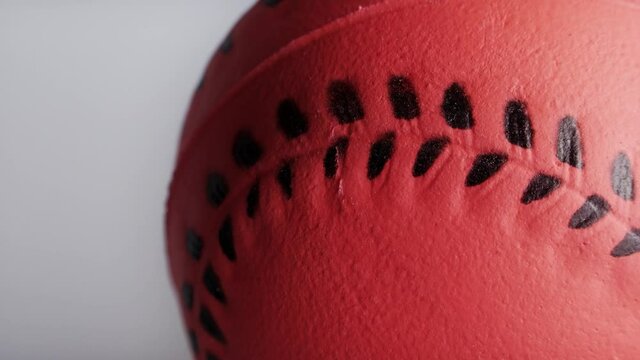 Orange rubber toy baseball close up background stock footage