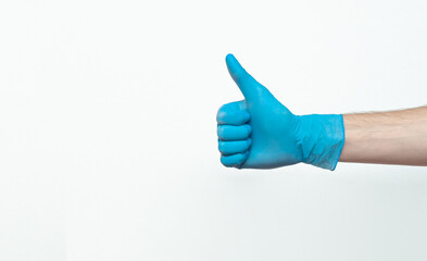 Doctor hand with glove showing like gesture or thumbup as approval, accept or done concept. Copy space. place for text