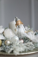 Cristmass decoration  with candle and doll  on table