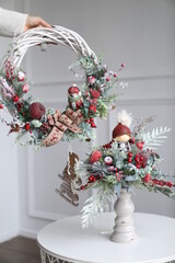 Cristmass decoration  with doll and candle on table