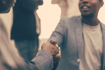 close up. young business partners shaking hands.
