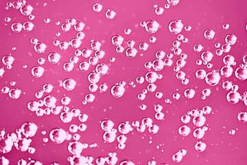 pink water bubbles background / fresh summer background pink air bubbles in water