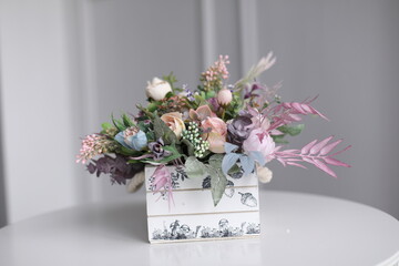 Flowers in box on table