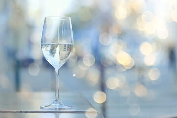 glass white wine restaurant interior, abstract evening dinner with alcohol at the bar