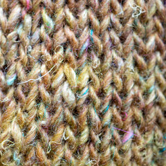 close up of knitted green yarn fabric 