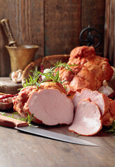 Smoked ham on an old wooden table.