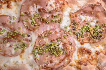 Pizza with mortadella and pistachios