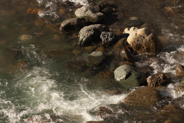 Mountain river. Stones. Coldwater. Flow.