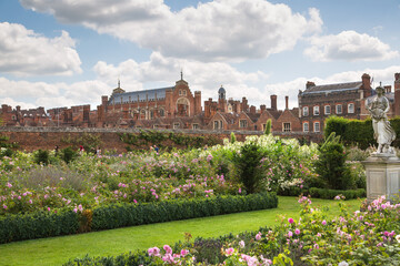 Fototapeta premium London, UK - July 29, 2019: English garden view and the East Front of Hampton court 17th century locates West London