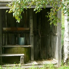 rustic well with a metal bucket on a chain