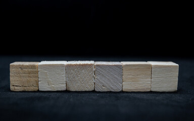 Wooden cubes isolated  on black background.