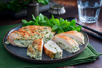 Baked chicken breast stuffed with cheese and spinach, horizontal