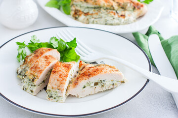Baked chicken breast stuffed with cheese and spinach, horizontal