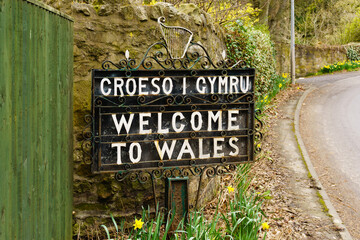 Bilingual welcome to Wales sign in Welsh and English marking the border between England and Wales