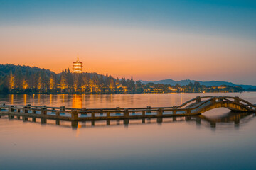 Obraz na płótnie Canvas The sunset view of the bridges and towers at the West Lake in Hangzhou, China.