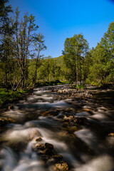 Stream of water from a flat river
