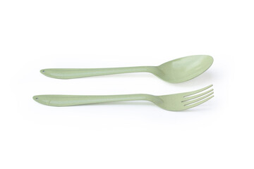Metal spoon and fork light green isolated on white background clipping path.