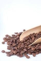 top view of fresh coffee beans on white background with copy space.
