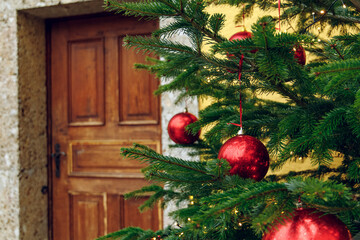 Christmas tree red balls toy rustic holidays decoration in poor ghetto back street district area...