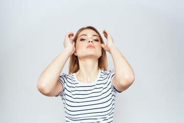 cute blonde girl in striped t shirt lifestyle studio