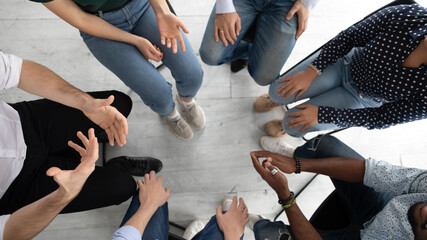 Psychological assistance. Close up of diverse group of unknown young people sitting in narrow...