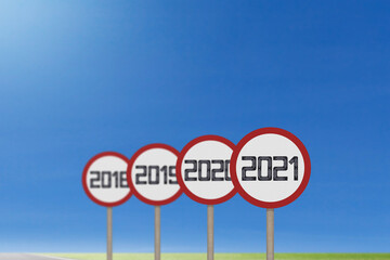 2021 road sign with empty asphalt road on blue background. Concept for success in the future goal and passing time. Happy new year