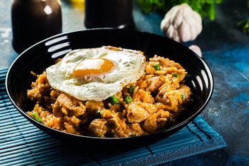 Spicy fried rice with chicken, kimchi and egg