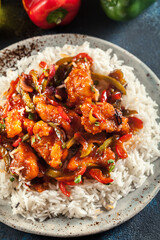 Sweet and sour chicken with colorful bell pepper with rice