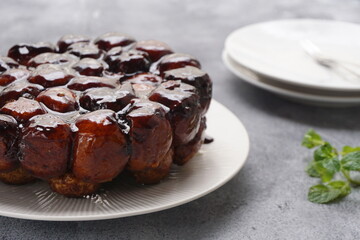 View of small group of white wild flowers in blurry grass background. Selective focus