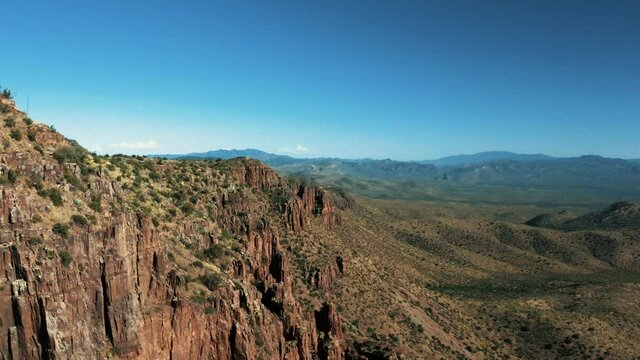 Aerial drone view of forests and cliffs at Theodor Roosevelt lake overlook in Tonto National Forest in Arizona, United States