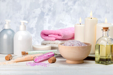 Obraz na płótnie Canvas Aromatherapy, spa, beauty treatment and wellness background with massage oil, sea salt, towels, cosmetic products.