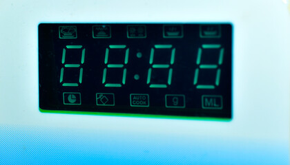 Green dial with programs on the microwave close-up