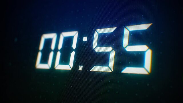 Close-up of 60 Seconds countdown White numbers on a Computer Screen in Defocus. 1 minute countdown. 30 or 10 seconds. White digits on a Black Background