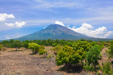 View from Tulamben village to Mount Agung. Mount Agung is popular tourist hiking route and highest active volcano on Bali island, Indonesia. © Tropical studio