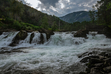 Strong and wide waterfall at the Fossestien