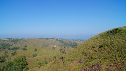 Fototapeta na wymiar Top of a hill with full of grass in vagamon, Kerala, India