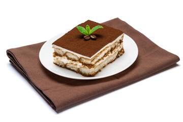 Traditional Italian Tiramisu square dessert portion on ceramic plate isolated on white background with clipping path